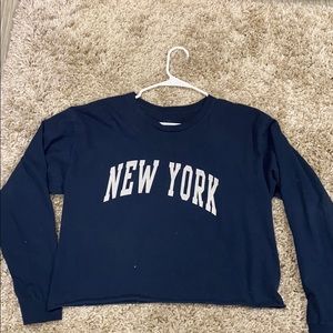 Navy blue brandy long sleeve that says New York